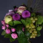 Flower bouquet with apples and grapes