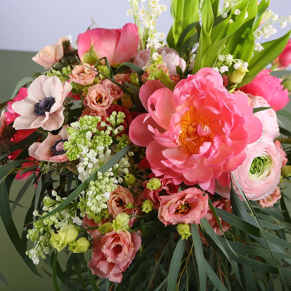 Bouquet of peonies and lilies of the valley