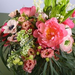 Bouquet of peonies and lilies of the valley