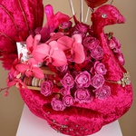 Floral composition in pink peacock with roses and balls