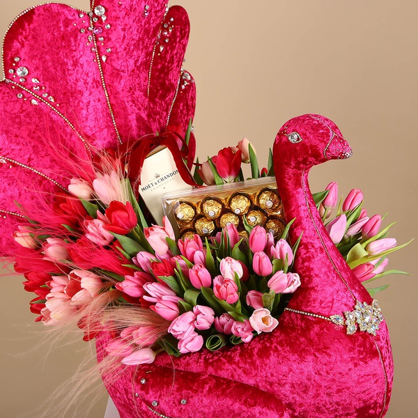 Floral composition in pink peacock with tulips