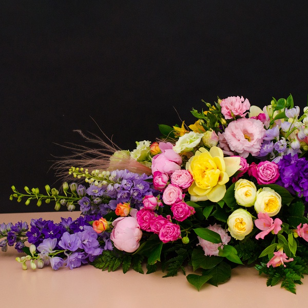 Funeral composition with delphinium