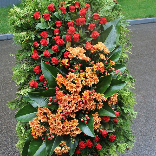 Mourning wreath with orange chrysanthemum