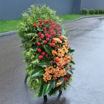 Mourning wreath with orange chrysanthemum