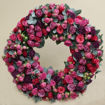 Funeral wreath of roses, carnations and eucalyptus