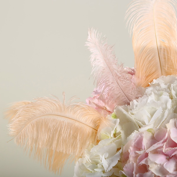 Bouquet of hydrangeas and feathers