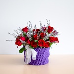 Red rose with lavender in a wicker box