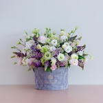 Floral composition with eustoma and lupine in a box