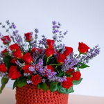 Composition of red roses with lavender