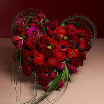 Floral composition in heart-shaped red