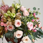 Floral interior composition in pink tones with Protea