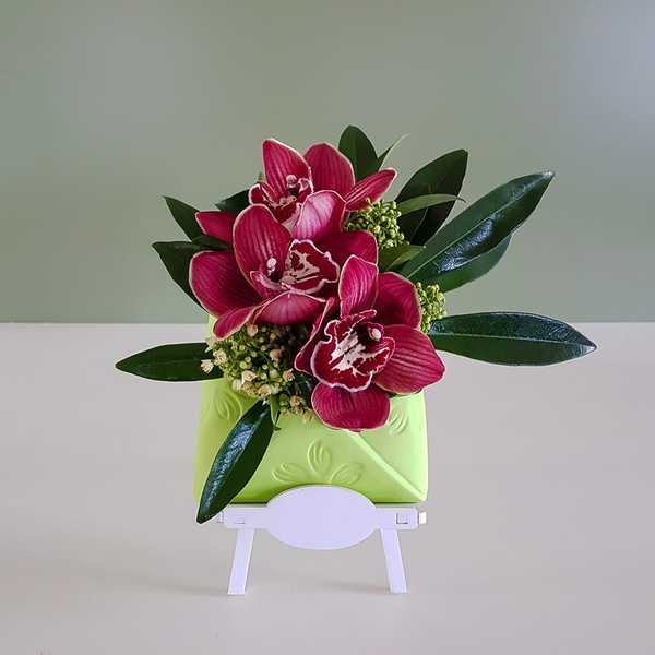 Composition in envelope with cymbidium