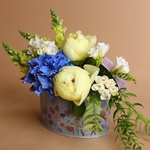 Floral composition with yellow peony and freesia