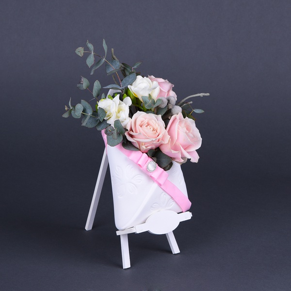 Flowers in an envelope in white and pink colors