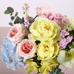Bouquet with garden roses and yellow peonies
