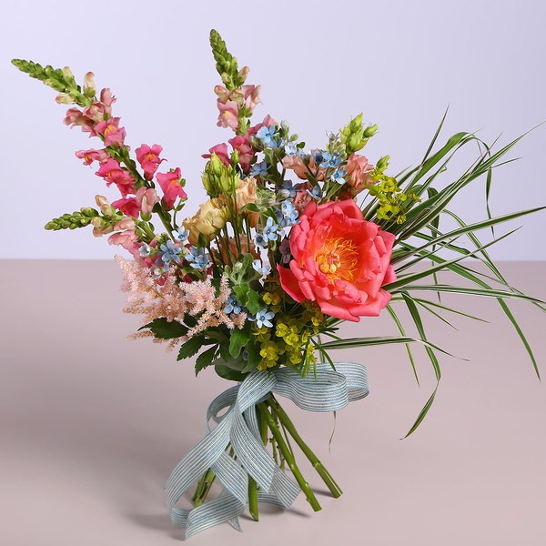 Field bouquet with coral peony