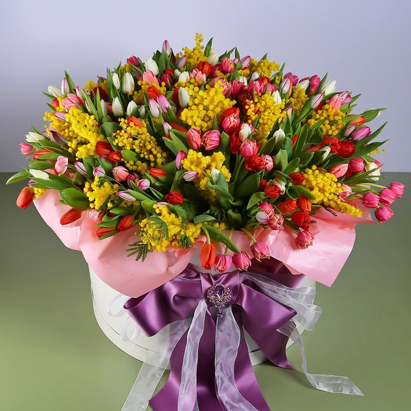 Floral composition of tulips with mimosa