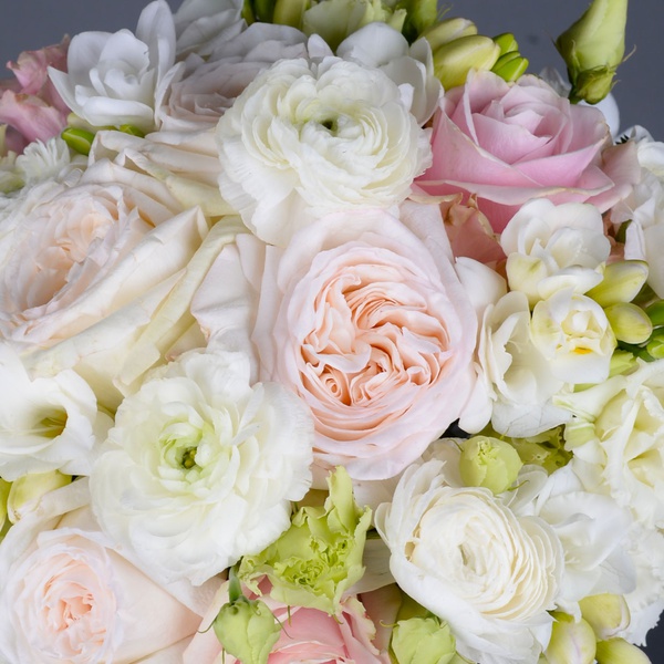 Wedding bouquet with ranunculus and delicate roses