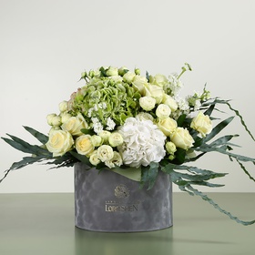 Flower in a box in white and green tones