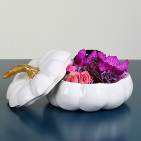 Floral composition in white pumpkin with jam