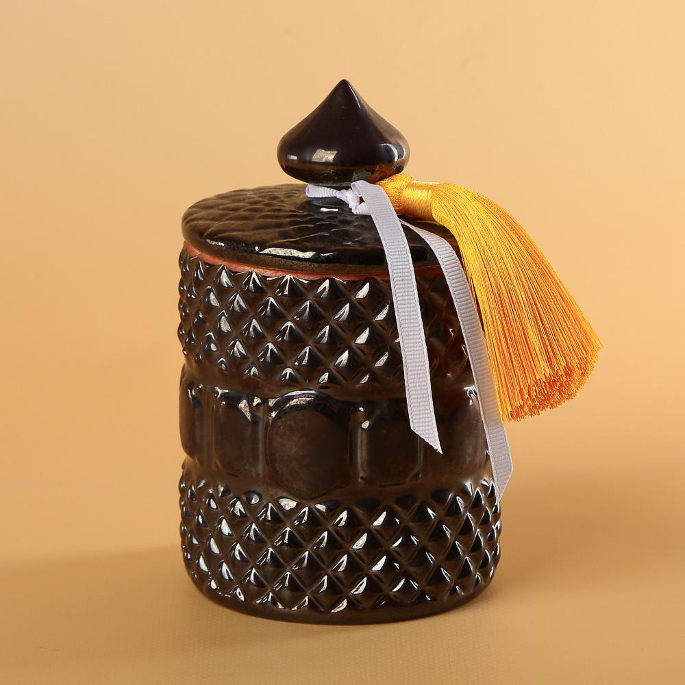 Scented candle in a ceramic glass with a lid