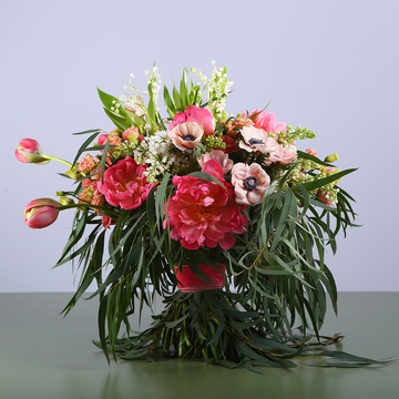 Bouquet of peonies and lilies of the valley