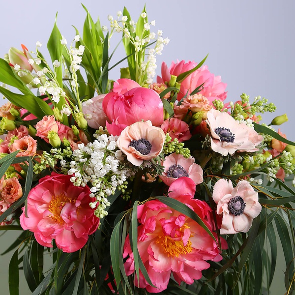 Bouquet of peonies and lilies of the valley