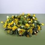 Floral composition with tulips and candles