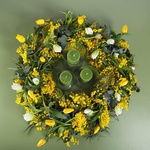 Floral composition with tulips and candles