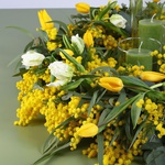 Floral composition with tulips and candles