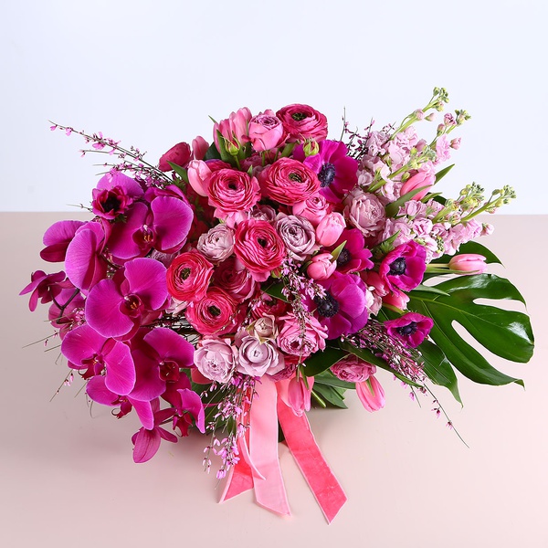 Bouquet in crimson tones with phalaenopsis