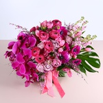 Bouquet in crimson tones with phalaenopsis