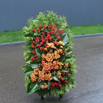 Mourning wreath with orange chrysanthemum