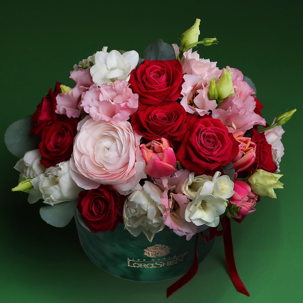 Delicate flowers in a velvet hat box