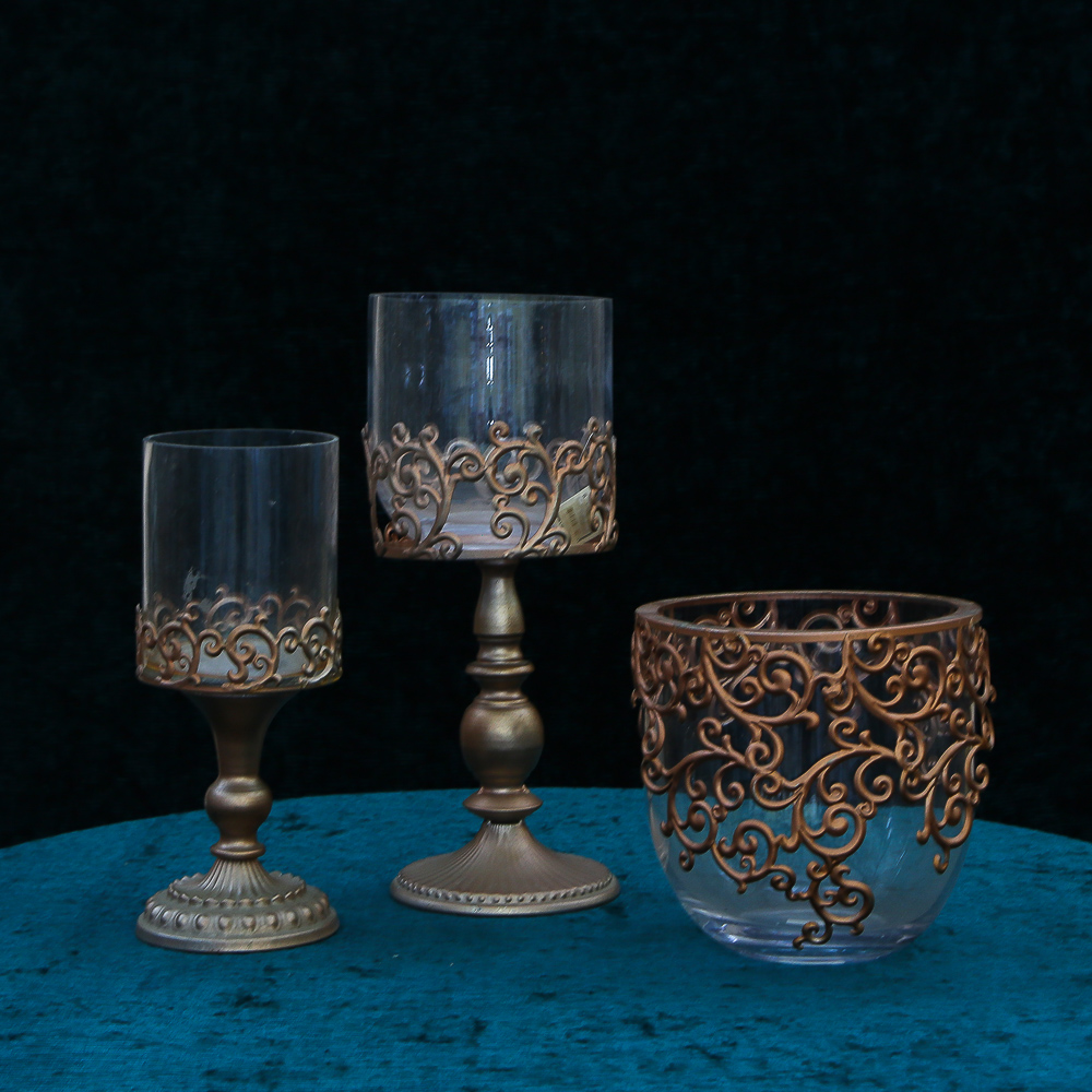Set of elegant candlesticks on a figured leg in the color "antique copper"