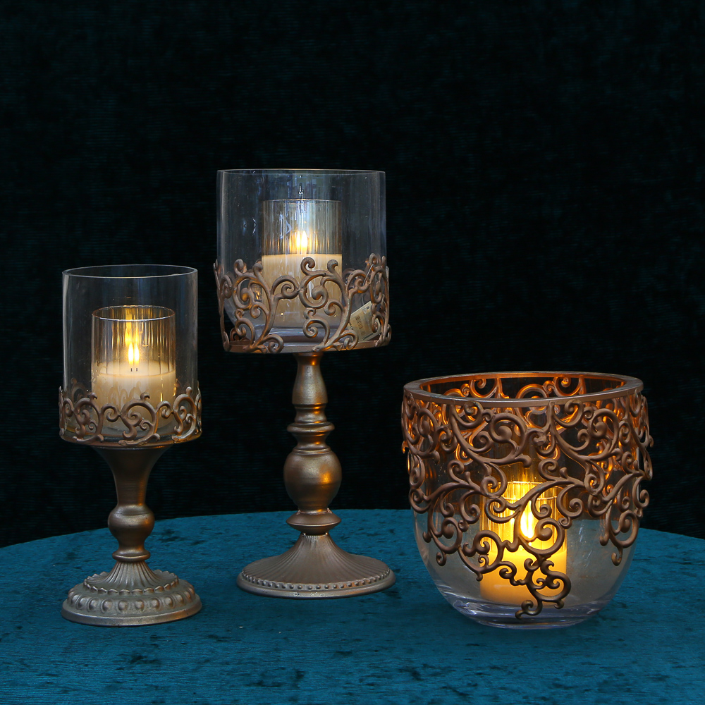 Set of elegant candlesticks on a figured leg in the color "antique copper"