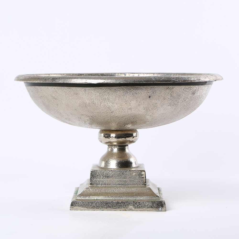 Tall decorative stand on a metal stem