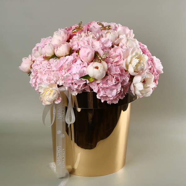 "Honey Garden" - a composition of hydrangeas and peonies in a golden pot