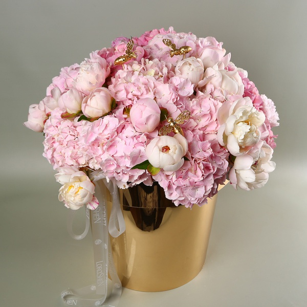 "Honey Garden" - a composition of hydrangeas and peonies in a golden pot