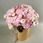 "Honey Garden" - a composition of hydrangeas and peonies in a golden pot