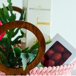 Gift set of peonies mix and strawberries in a bag
