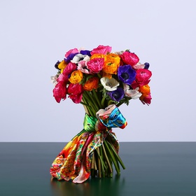 Bright bouquet of anemones and ranunculus
