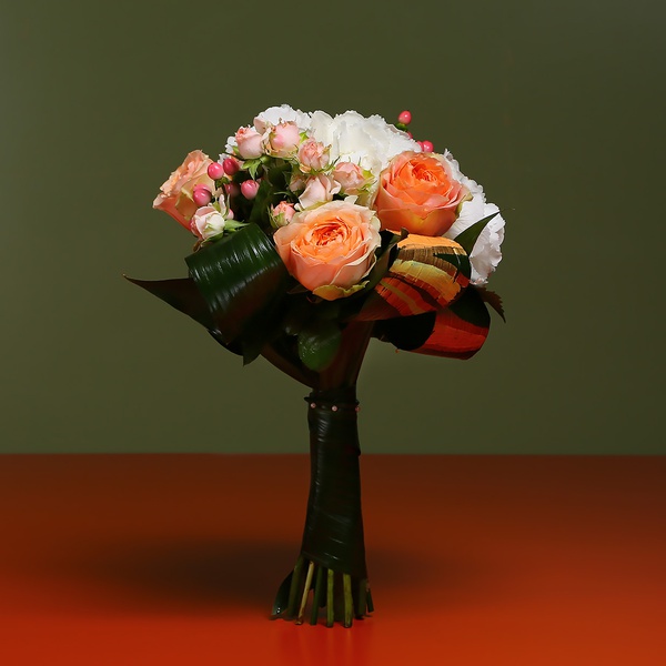 Bouquet of hydrangea and colored greenery