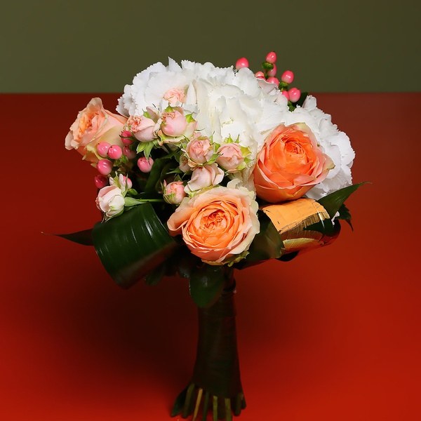 Bouquet of hydrangea and colored greenery