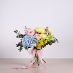 Bouquet with garden roses and yellow peonies