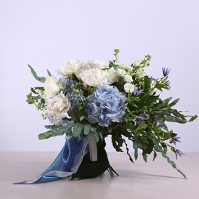 Summer bouquet with blue hydrangeas