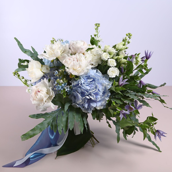 Summer bouquet with blue hydrangeas