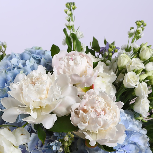 Summer bouquet with blue hydrangeas