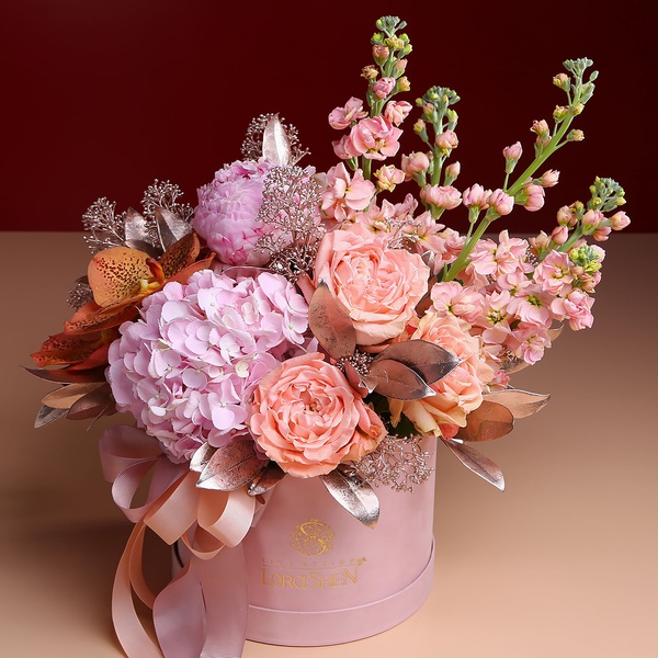 Floral composition in pink and peach tones