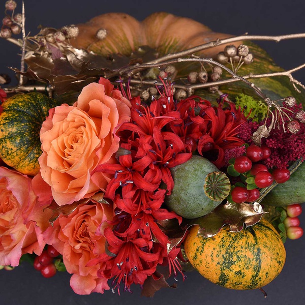 Floral composition in pumpkin orange with gold